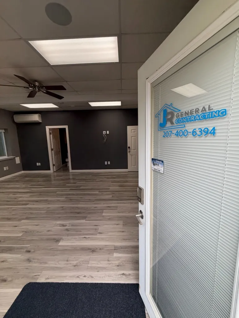 JR General Contracting office interior with branded door signage